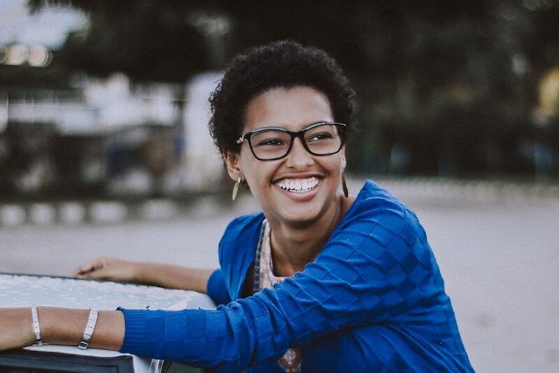 Photo by Caique Nascimento woman beside white vehicle during daytime